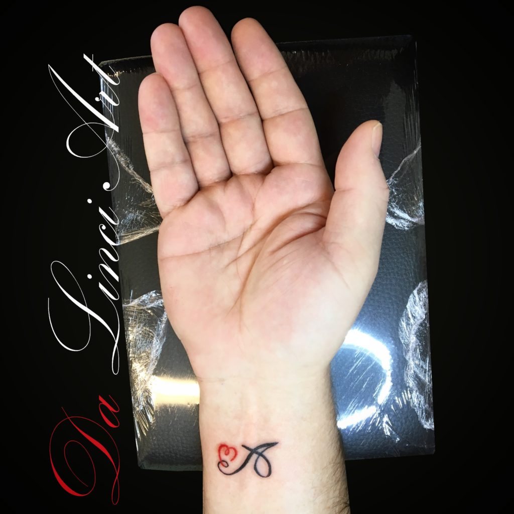 #tattoo #tattoos #a #heart #writing #writingtattoo #hearttattoo #red #redheart #blackandred #blackandredtattoo #tattooshop #zwijndrecht #dalinciart